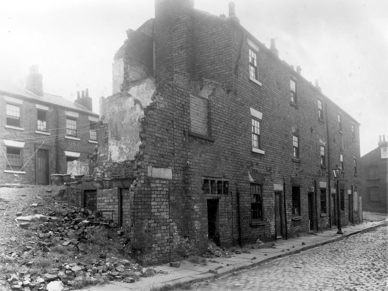 Well on the way to being demolished, this was a row of terraced houses on Hillside Street. Left was number 14 and numbers descended to 6 on the right. The eight individual toilets have been cleared and are just a pile of rubble, far left. Part of the locality known as Newtown. Pictured in October 1958.