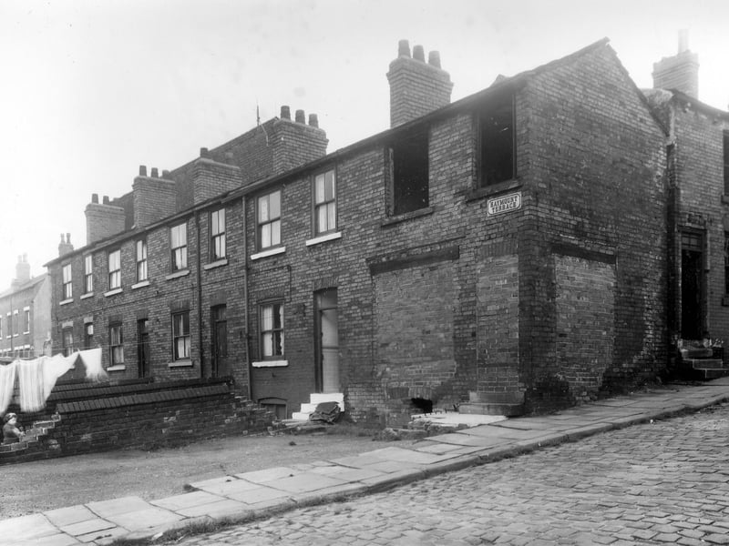 Red brick constructed terraced housing on Haymount Terrace in October 1958. Number 2 was at one time a shop and is listed as being a confectioners shop run by Mrs Agnes Louise Nurse in the 1932 Kelly's Directory. Now its doors and windows have been bricked up and the whole terrace was eventually demolished.