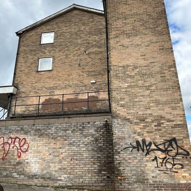 Pictured is the Gaunt shopping area on Blackstock Road before the mural.