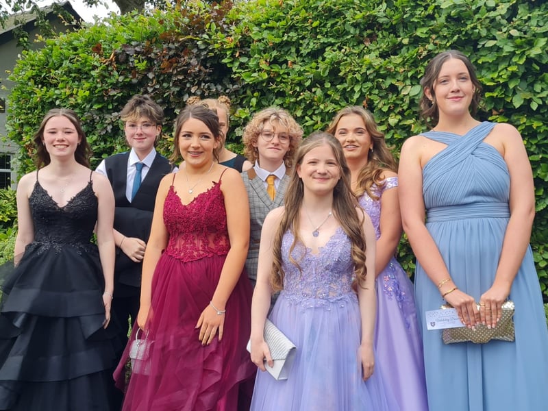 A large group of happy school leavers arrive