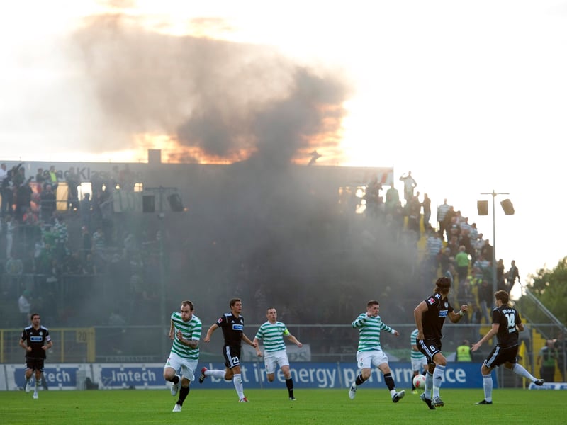 A cloud of smoke drifts across the pitch as Celtic battle with Aalen during their pre-season friendly