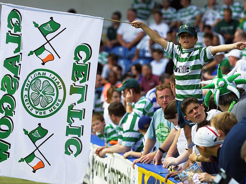 A young Celtic fan enjoys the superb atmosphere in London during the Pre-Season Friendly match between Queens Park Rangers and Celtic in 2002.