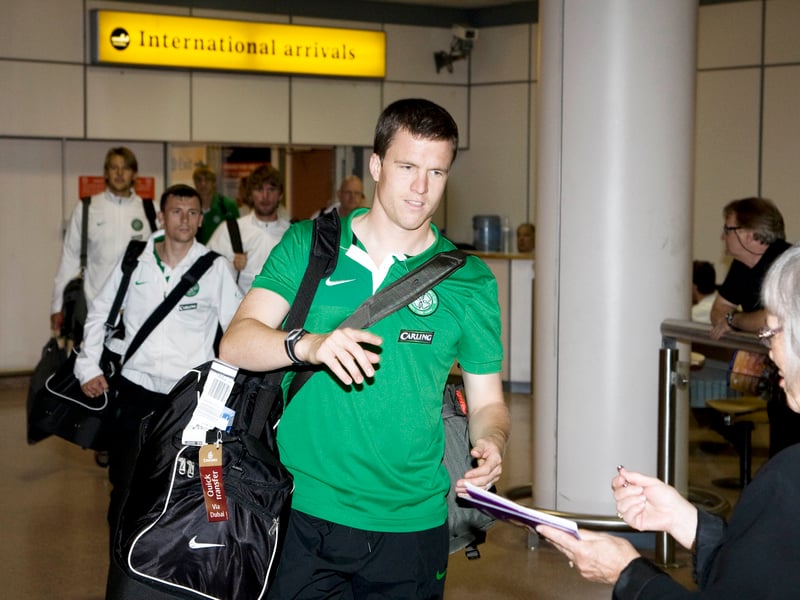 Gary Caldwell is greeted by fans at Glasgow Airport.