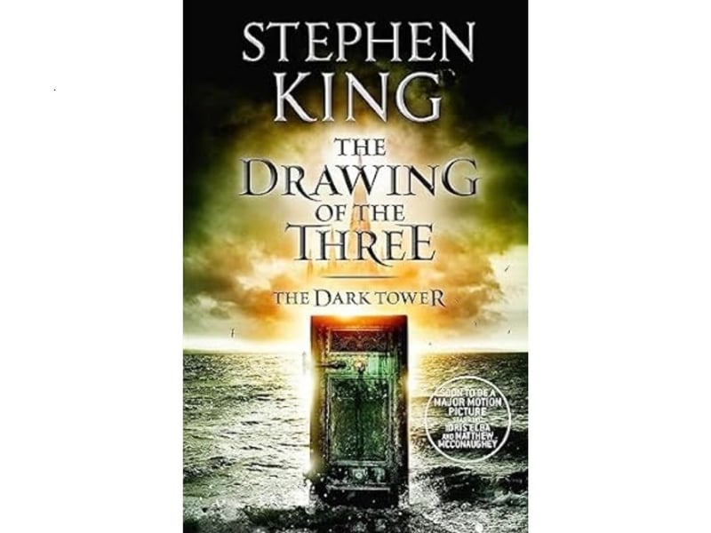 The second book in King's The Dark Tower fantasy series is his 12th best book according to readers. The Drawing of the Three scores an average rating of 4.23 from 265,529 reviews. "In the second novel of Stephen King's bestselling fantasy masterpiece, Roland of Gilead, the Last Gunslinger, encounters three mysterious doors which open - for Roland, and Roland alone - to different times in our world. He must draw the three who should accompany him on the road. The first door opens to 1980s New York, where Roland joins forces with defiant Eddie Dean. The second leads to the 1960s and conflicted civil rights activist Odetta Holmes. The final door reveals Jack Mort, a deadly serial killer, in the 1970s. Mort is stalking Jake, the young boy Roland met in Mid-World. As titanic forces gather, a savage struggle between underworld evil and otherworldly enemies threatens to bring an end to Roland's journey toward the Dark Tower..."
