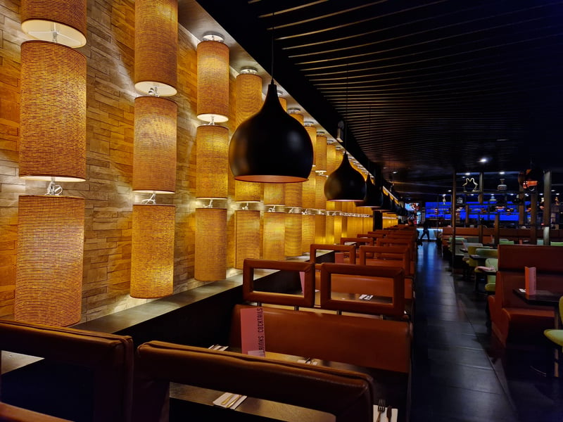 Tastefully decorated interiors, pendant lighting and comfy booths makes the dining experience a classy one