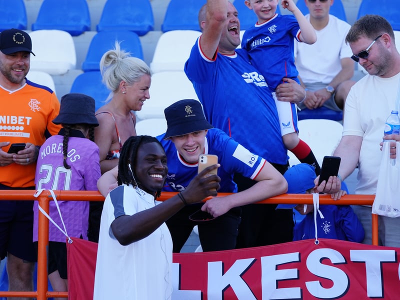 Ex-Rangers star Calvin Bassey takes a selfie with a Rangers fan before the pre-season game with Sunderland in Albufiera in 2022.