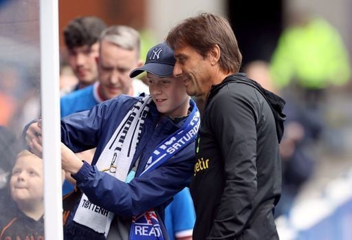Ex-Tottenham Hotspur manager Antonio Conte poses for a picture with a young Rangers fan during pre-season 2022.