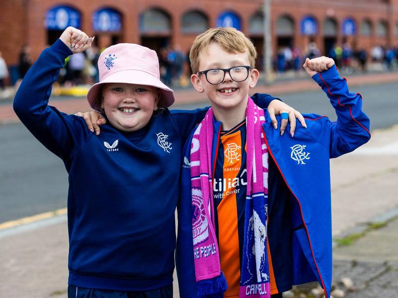 Two young fans arrive at Ibrox ahead of the game vs Olympiacos in 2023.
