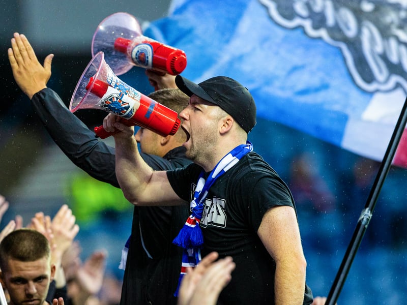 Rangers fans with a megaphone during a pre-season friendly between Rangers and Olympiacos at Ibrox in 2023.