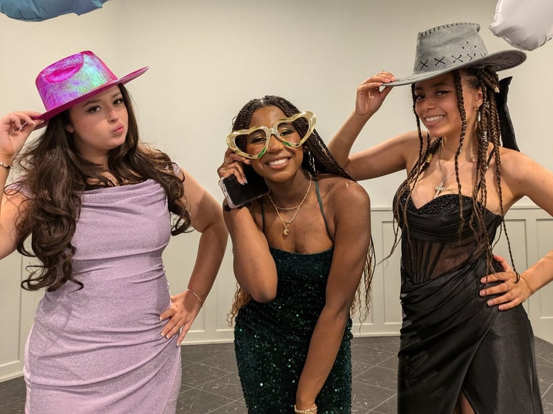 PGHS leavers pose with their photobooth accessories