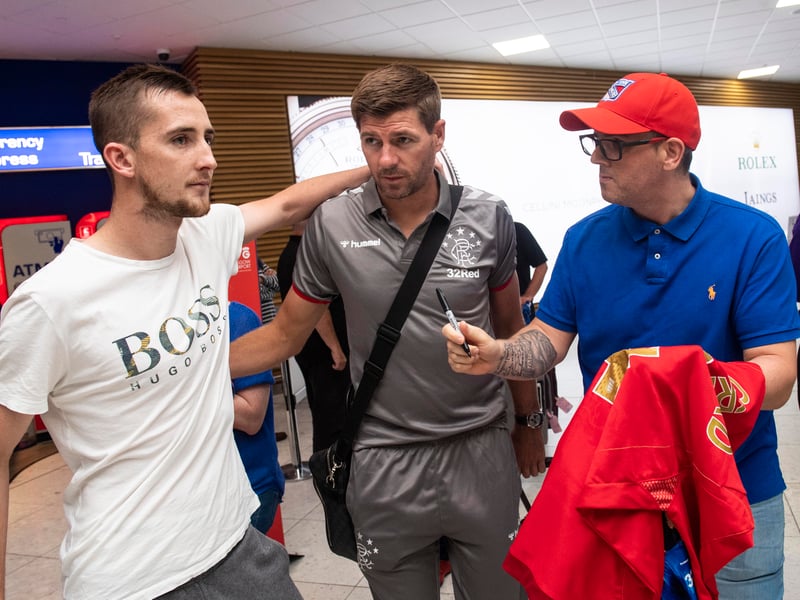 Ex-Rangers manager Steven Gerrard meets some fans at Glasgow Airport.