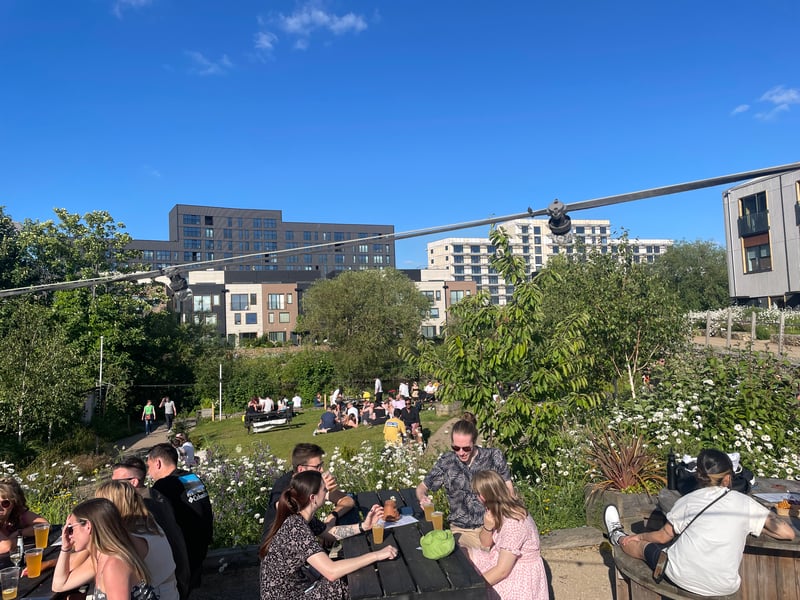 Grass-knoll terrace on River Aire, homebrew ales and weekly street food.