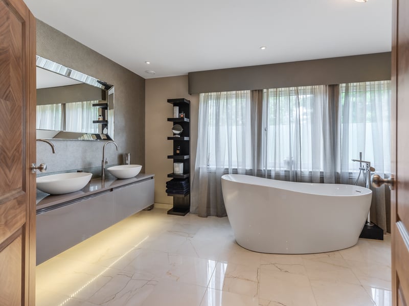 One of Heathfields's bathrooms, with double sinks and freestanding bath.