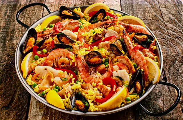 The traditional Spanish dish which is made of rice, saffron, as well as chicken or seafood has been voted the best-loved holiday meal of all time. Paella originates from the region of Valencia, and takes its name from the pan it is made in. (Photo: exclusive-design - stock.adobe.c)