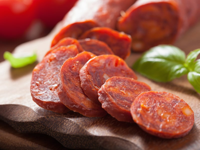 Another Spanish favourite, Chorizo is a type of pork sausage which originates from the Iberian Peninsula. The spicy meat is usually added as a topping to dishes, including paella and pasta, but is also used on pizza or eaten on its own. (Photo: Olga Miltsova - stock.adobe.com)