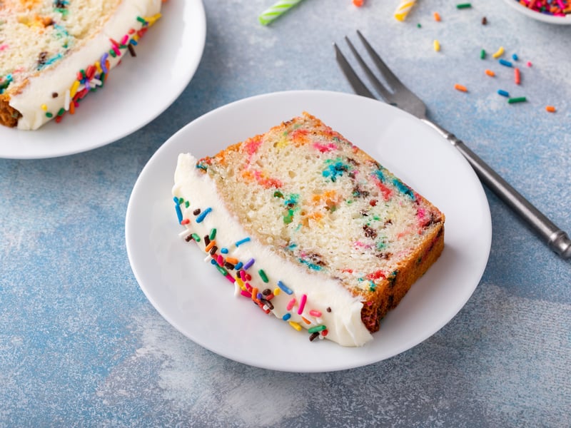 Sprinkle sponge cake is exactly what it sounds like, a sponge cake topped with a sprinkle coated icing. Although a fairly dry sponge, the dessert was loved by many, with many bakeries across the UK bringing the nostalgic pudding back. (Photo: fahrwasser - stock.adobe.com)