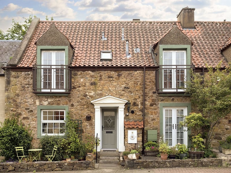 This Haddington property is a beautiful three-bedroom, stone-built, med-terrace cottage which has an abundance of character. Outside, the home has a private front garden for potted plants and a charming seating area. The courtyard development also provides residents' parking.