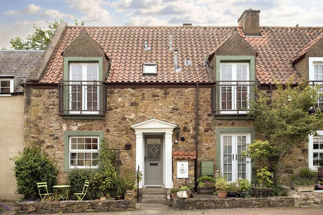 This Haddington property is a beautiful three-bedroom, stone-built, med-terrace cottage which has an abundance of character. Outside, the home has a private front garden for potted plants and a charming seating area. The courtyard development also provides residents' parking.