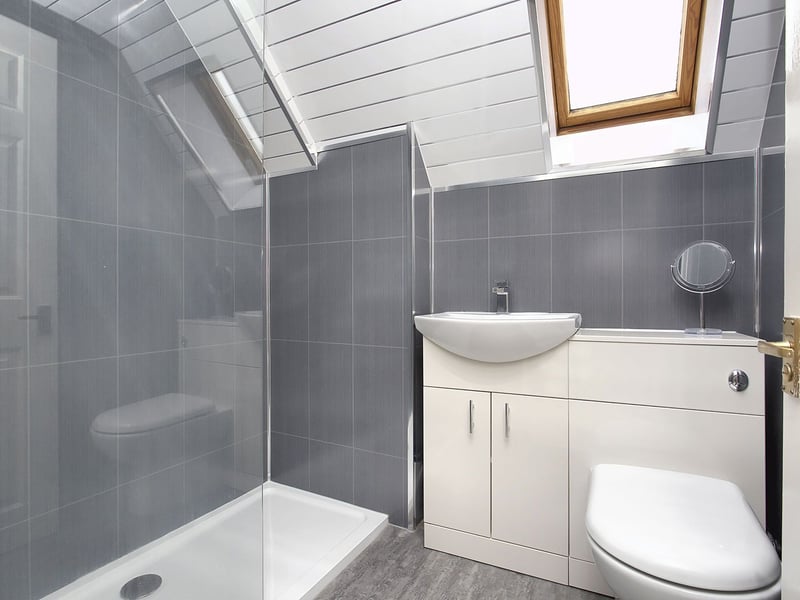 Completing the first floor is a modern three-piece shower room with a double walk-in shower enclosure. Gas central heating and double glazing ensure year-round comfort.