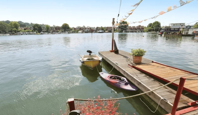 The listing says: "The lower deck has a large open kitchen and dining area, two bedrooms (one of which is currently used as a home office) and family bathroom with corner bath and shower." 