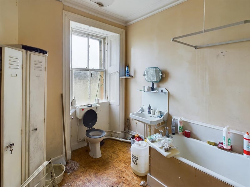 The bathroom, while dated, has plenty of space to serve the two floor house.