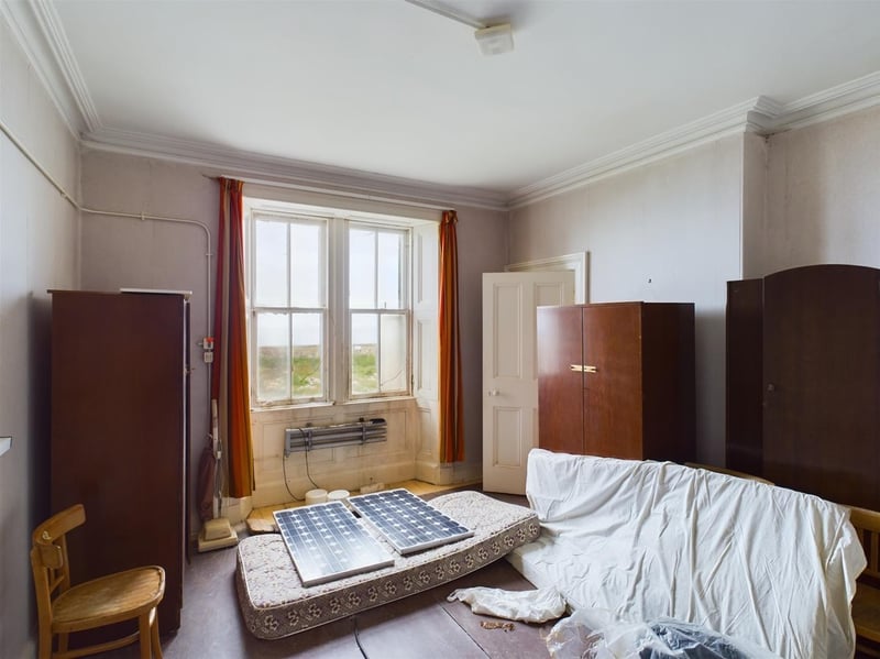 This bedroom is particularly bright, thanks to its large windows - perhaps explaining the presence of solar panels.