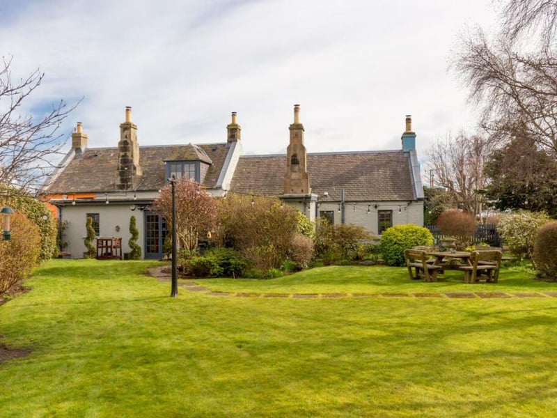 This is a quirky and colourful home, which has been created from a 19th Century school building.