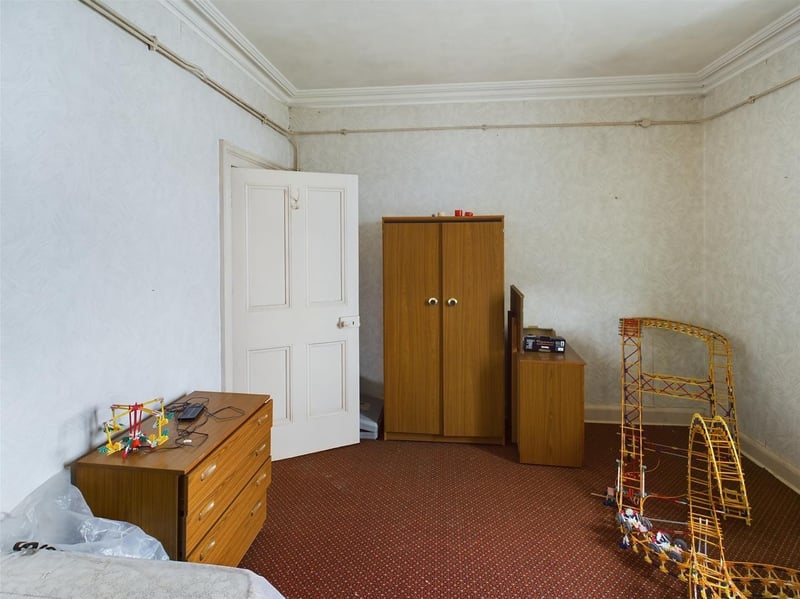 Another view of the bedroom showcases the furniture and toys.
