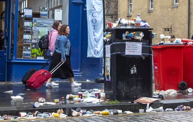 An overflowing bin on Edinburgh's Royal Mile as waste strikes stretched into a fifth day