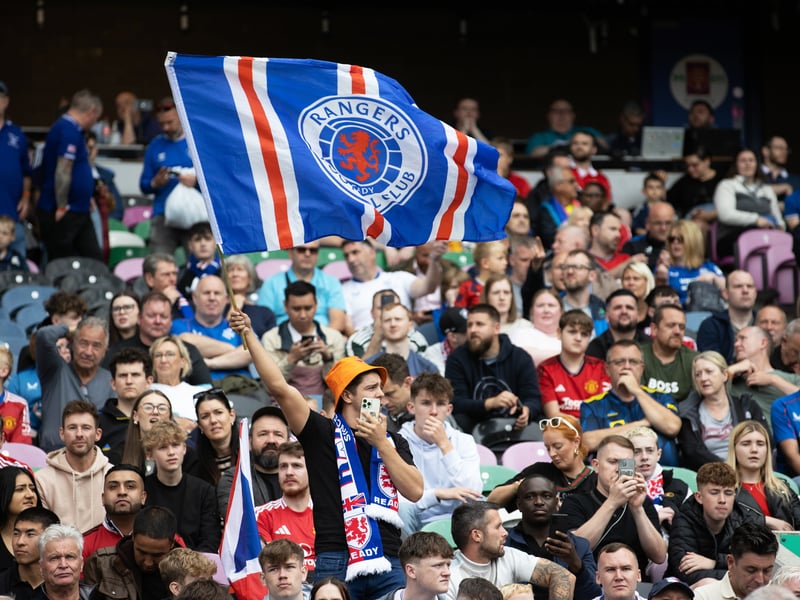 One Rangers fan waves a giant Gers flag during the clash against Manchester United.