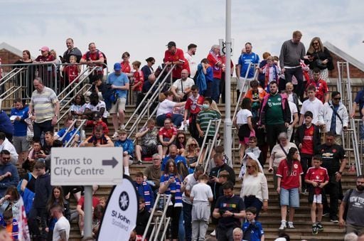 Both sets of supporters depart the stadium following Rangers 0-2 Manchester United.