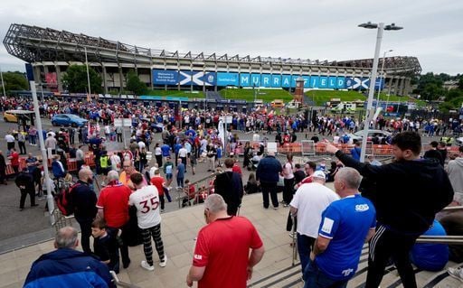 Fans arrive at Murrayfield for the game between Rangers and Manchester United.