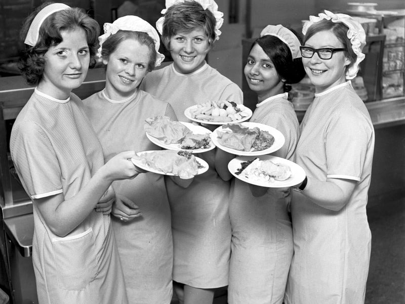 Catering staff at the Commonwealth Games Village restaurant showing off national dishes in July 1970.