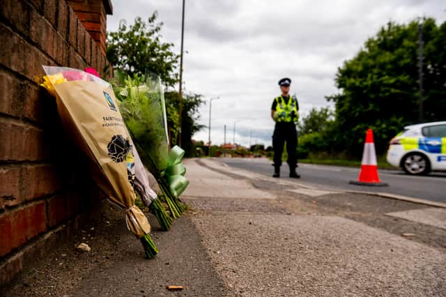 Floral tributes left close to the police cordon for the fatal crash where six people, including two children, were killed.