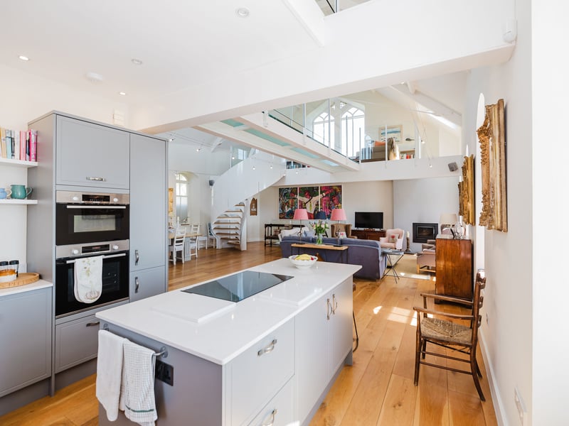 The layout makes this an upside-down house, with its bedrooms on the lower ground floor and living space above, to take advantage of the fabulous views. The open-plan main space includes a sitting room, dining area and kitchen.