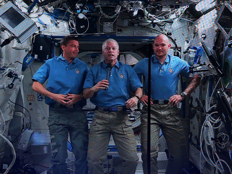 Flight Engineer Reid Wiseman, Commander Steve Swanson, Flight Engineer Alexander Gerst of the International Space Station speak via videolink during the Opening Ceremony.