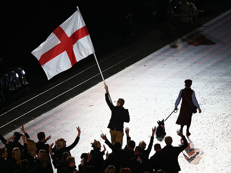 Squash player Nick Matthew leads Team England into the stadium.