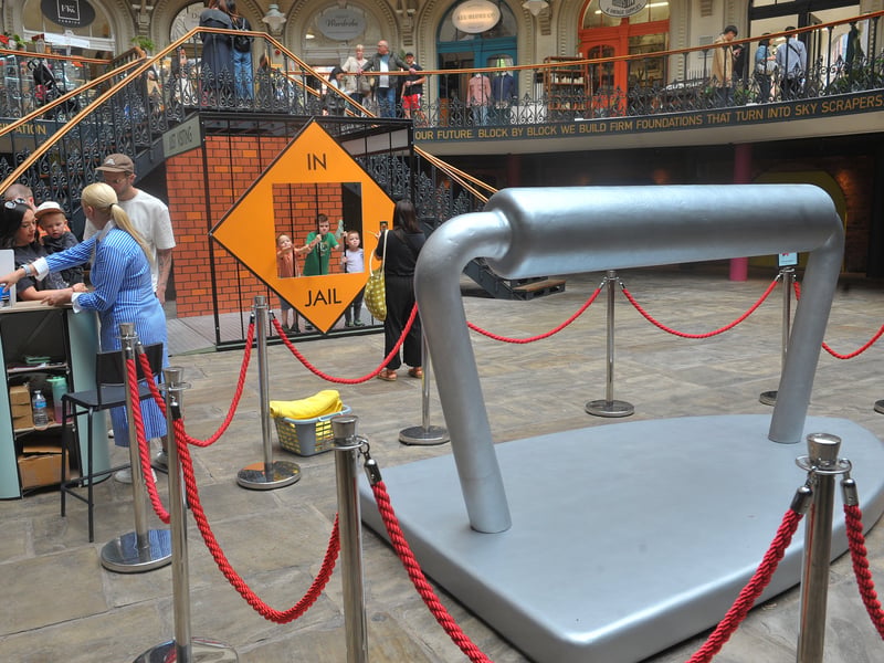 A giant iron token and a jail provide great photo opportunities at the Corn Exchange.