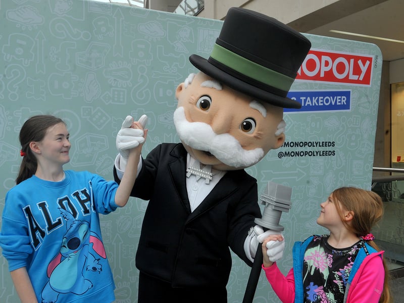 Mr Monopoly meets Kelsi Calder, 23, and Zoey Taylor, 10, at Leeds Trinity.