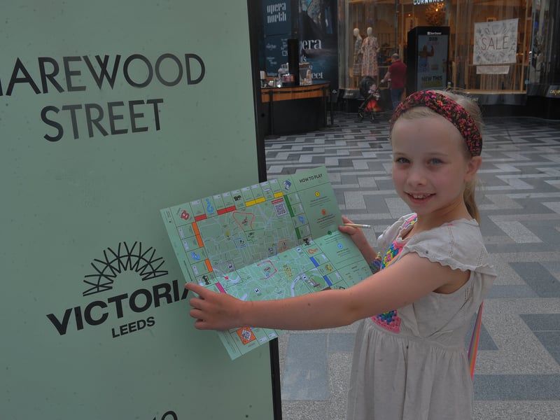 Phoebe Fairclough, eight, from Moortown, chalks Harewood Street in Victoria Gate off her map.