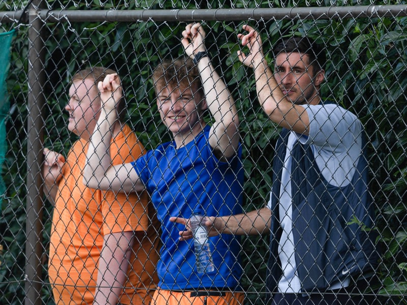 Fans watch through the fence during a pre-season friendly match between Rangers and Standard Liege in Netherlands.