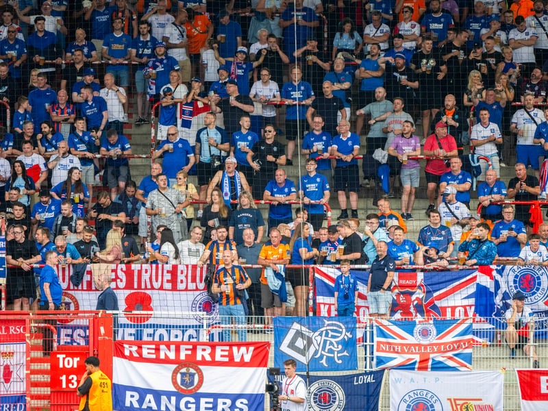An array of flag adorn the Rangers away end in Berlin.
