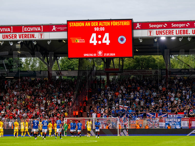 Rangers fans salute the fans at Stadion An der Alten Forsterei.