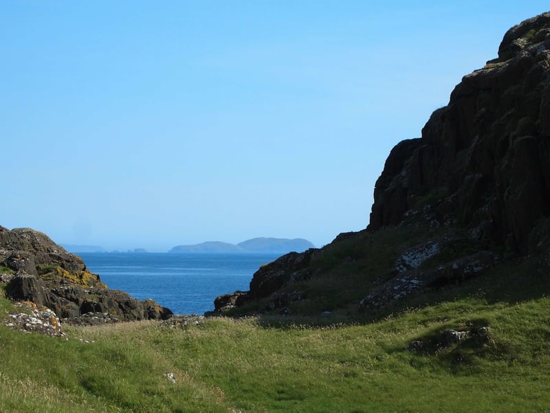 The photo shows the view to the north of the island where you can see the Shiant Isles which sit near Harris in the Outer Hebrides