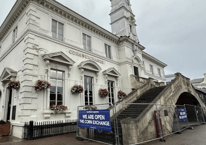 The Corn Exchange takes its name from being an actual Corn Exchange building, which was built in 1850. A corn exchange was a place for merchants to trade grains. The earliest structure on the site was built in the 15th century, before being rebuilt in 1509 for the Gainsborough, a prison and law court.