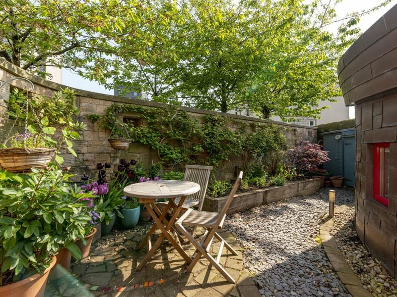 Outside, there is a charming walled garden with paved patio, raised planters and a garden shed and the property benefits from a parking space at the side of the house.
