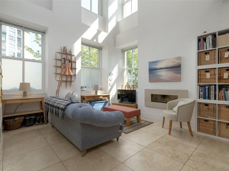 Inside, part of the living space is double height, lit by two banks of windows. 