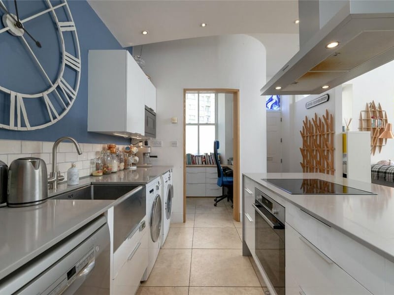 A study area is located off the kitchen.