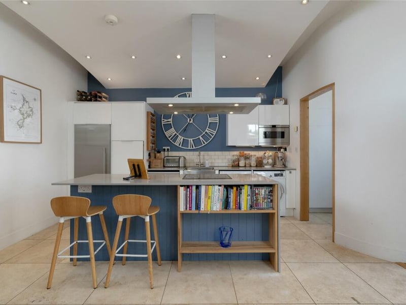 The kitchen area incorporates a silestone worktop and breakfast bar and has a range of appliances including an American style fridge/freezer, oven, induction hob, extractor, dishwasher, microwave, washing machine and tumble dryer.