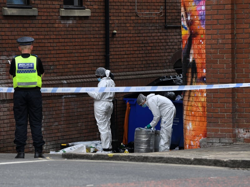 Police forensics were photographed hard at work.